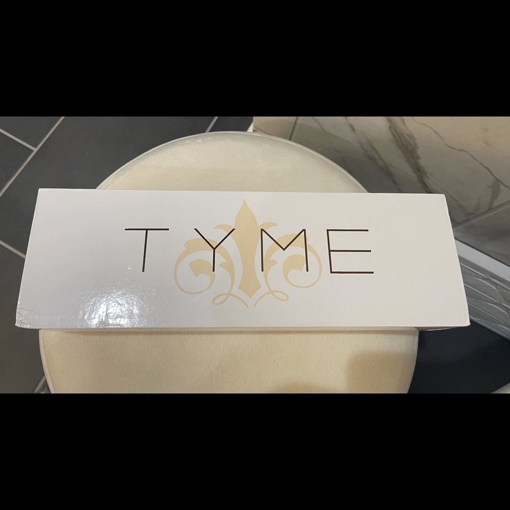 Tyme straightener and styling iron never been used